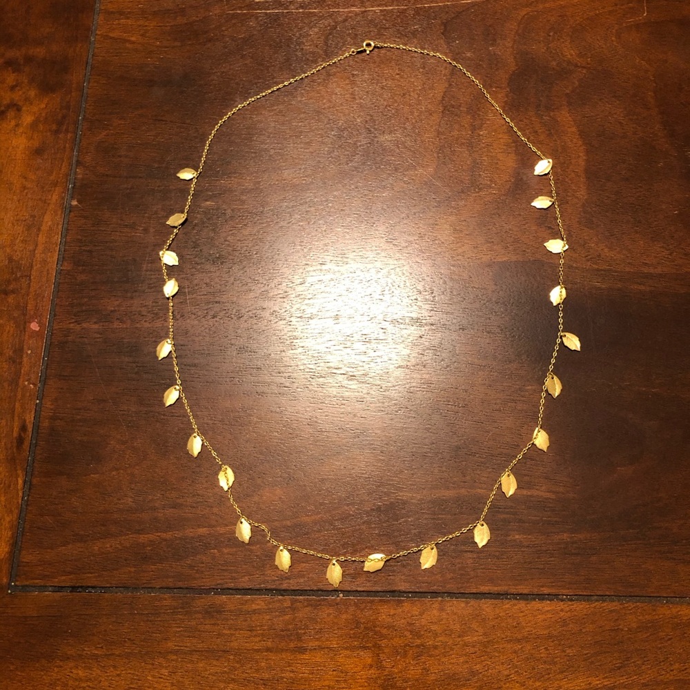 Long gold chain necklace with detailed leaves